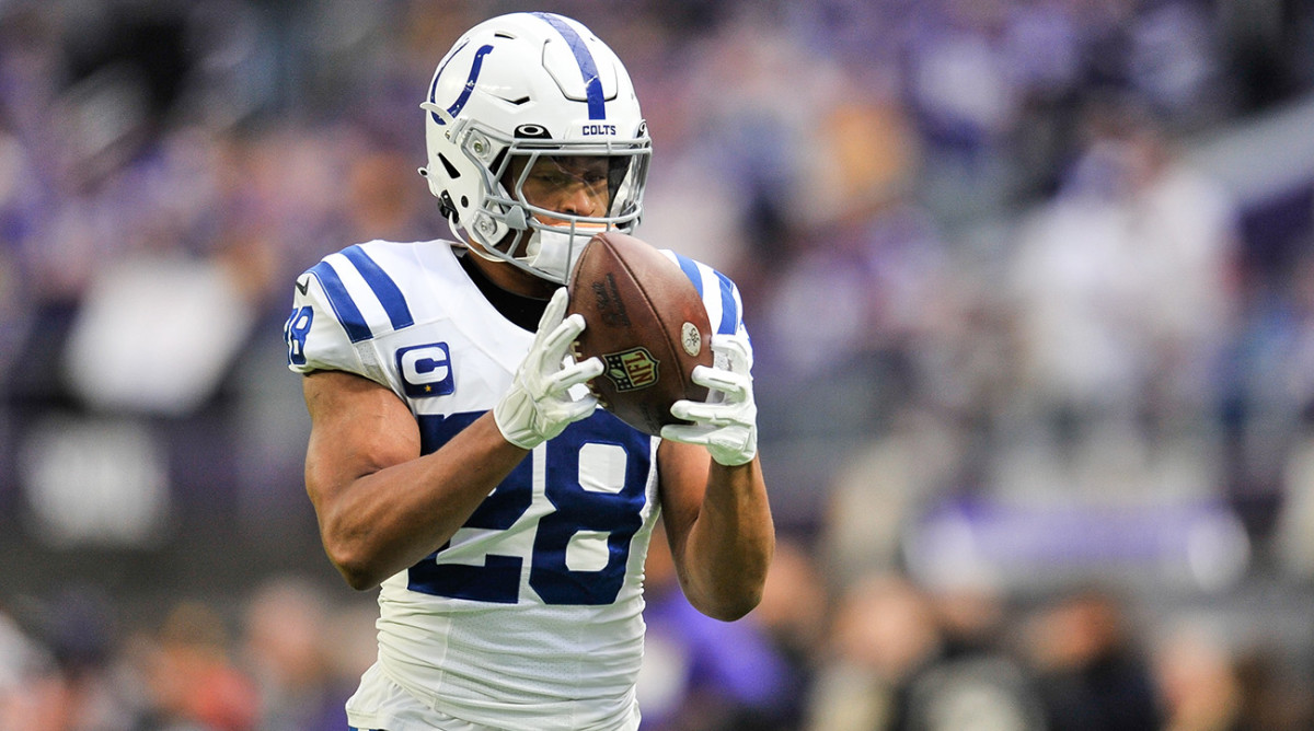 Indianapolis Colts running back Jonathan Taylor (28) warms up before the game against the Minnesota Vikings at U.S. Bank Stadium.
